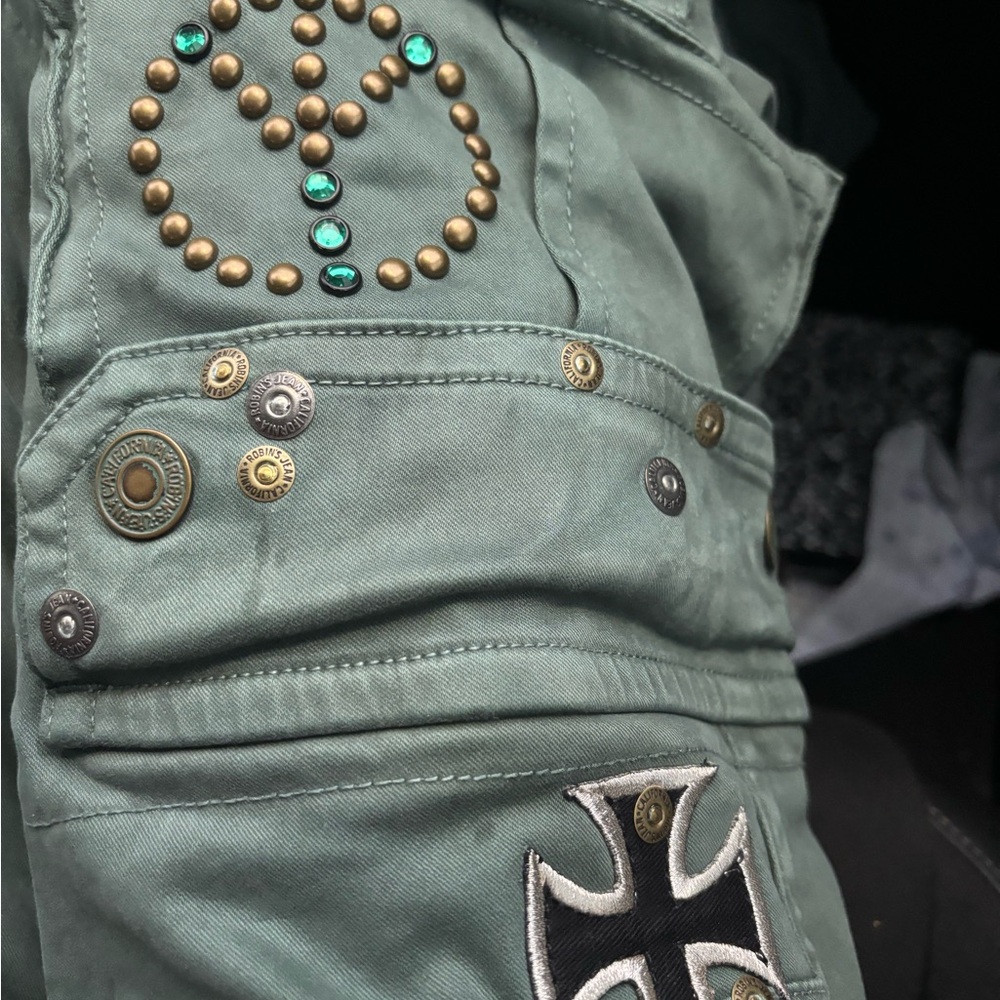 Robin's Jean Green and Gold Bootcut Jeans with Peace Sign Studs